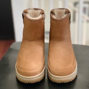 Ugg water proof boots in Chestnut size 7.5 never worn no rips or stains.